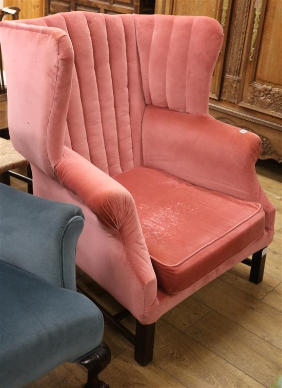 A George III style pink dralon upholstered wing armchair